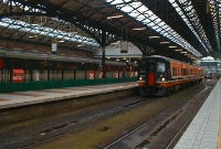A 2-car 2800 Class railcar is seen at the buffer stops adjacent to the main concourse at Connolly Station while operated a commuter service to Drogheda. Nowadays commuter trains are formed of 4 to 8-car railcar sets.