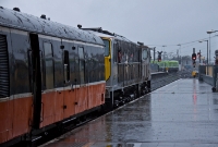 In the lashings of rain, 071 Class loco No.072 awaits departure time at Connolly&#39;s platform No.3 with an RPSI &#39;Mystery&#39; train to Limerick. Behind the loco is the Mk1 generator van, providing much heat to the 1960s Craven built stock.