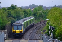 29000 Class railcar No.29112 heads out of Coolmine Station with a service to Clonsilla. In the foreground can be seen the station level crossing at Coolmine, once manually gate operated until 2001.