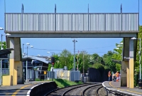 Coolmine Station opened in July 1990. It received a modern booking office, visible on the left beyond the down platform, with the upgrading of the line to Maynooth in 2000. The tall concrete footbridge dates from opening in 1990.