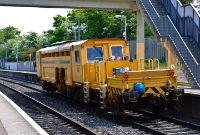 One of Irish Rail&#39;s many permanent way vehicles, No.742, is seen heading west through Coolmine Station.