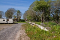 This is the former up platform at Crossbarry Station, looking west towards Bantry. The base of two former water cranes for steam locomotives survive at the station.
