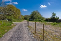 A view looking towards Cork from the east end of Crossbarry Station. There was a farm level crossing located here, which is still used to access a field on the right.