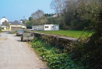 Another view of the remaining platform at Crosshaven station. The station buildings once stood where the school is now visible in the background.