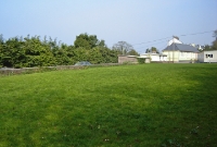 A general view of the station site, with the concrete platform visible on the left. The station buildings at Crosshaven were of the corrugated iron construction, similar to that found at nearby Carrigaline.
