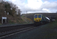 In matching silver &#38; green &#39;Intercity&#39; livery, 201 Class loco No.222 passes beneath the road overbridge at the Curragh platforms with a Cork bound express.