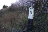 The 1840s Great Southern &#38; Western&#39;s granite mile posts still remain on the Dublin to Cork line. Here is one at the Curragh, indicating it is 27½ miles from Dublin Heuston.