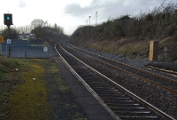 A view looking south from the end of the down platform at the Curragh. The short branch to the Curragh Racecourse once converged from the left. The branch closed in the late 1970s, but remained in situ until 1988.