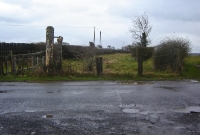 This was a level crossing on the branch leading to the Curragh Racecourse. One of the wooden crossing gate posts remain.