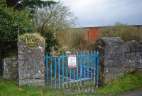 The gate entrance leading to the down platform at the Curragh. The station was last served by specials in the early 2000s, but has since closed altogether.