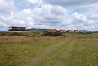 071 Class loco No.083 heads across the flat terrain of the Curragh with the morning Dublin to Ballina IWT freightliner.