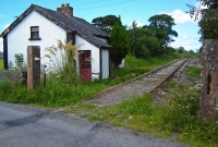 Drumbaun South level crossing following the clearance of vegetation, which has revealed the disused rusty track.