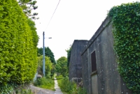 A view along the descent towards Dun Laoghaire on the trackbed of the former tramway, looking up towards Dalkey Quarry. The original stone granite bases for the tramway track still survive as seen here.
