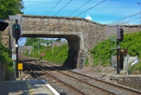 The bridge at the north end of Dalkey Station carries the Cunningham Road over the railway, a route which leads towards the main street of Dalkey. This bridge was one of many rebuilt in the eatly 1980s to accommodate the overhead wires for the DART. The granite abutment bases are original.