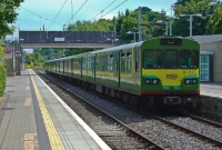 One of the refurbished 8100 Class DART units, No.8137, pauses at the north end of Dalkey Station with a service to Howth. The footbridge at Dalkey Station, visible in the background, replaced the original Victorian Dublin Wicklow &#38; Wexford Railways one in 1982. No.8137 was first built in Germany by Linke Hoffman Busch in 1983.