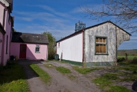 The rear of the small wooden station building at Desert, which dates from the opening of the line in June 1886. It has not seen a passenger since March 1961.
