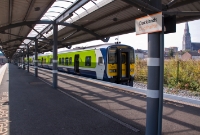 Most of the Dunboyne line services terminate at the Docklands Station, these services having originally served the Maynooth line as far as Clonsilla. The St Laurence O&#39;Toole church and spire is prominant in the background.