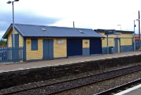The 1870s era wooden station buildings on the down platform at Donabate Station. Today they are simply used a storage and waiting shelter has been boarded up.