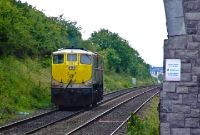 In silver &#38; black livery, 071 Class loco No.082 is seen light engine at the south end of Donabate, probably heading from Drogheda to Connolly Station. At one time the platforms at Donabate once extended to this point beyond the road overbridge.
