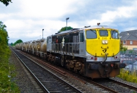 071 Class loco No.080 leads a train of 1960s vintage bulk cement wagons on the approach to Donabate Station. These wagons were returning loaded from the cement factory at Platin near Drogheda. Cement traffic on Irish Rail has however since ceased.