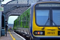 A scene at the up platform at Donabate Station, showing 29000 Class railcar No.29121 preparing to leave on a Dublin Connolly bound service, while in the distance an empty Tara Mines train approaches.