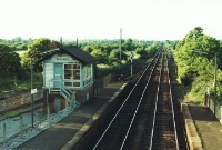 A similar but rural view taken at Donabate in the early 1980s, looking north towards Belfast when the signal cabin was still in use. There were two sidings at Donabate for handling goods traffic; one visible behind the down platform, while the other on the up side served the goods shed which had been demolished by this time. ©Barry Pickup