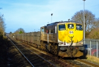071 Class loco No.073 approaches Donabate at a gingerly pace as it leads its rake of empty Tara Mines wagons from Navan. The wagon visible behind the locomotive is in fact a former shale wagon, converted for the Tara Mines ore traffic.