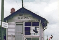 A view of Donabate signal cabin in the summer of 1983, shortly before the cabin closed. The cabin was frequently &#39;switched out&#39; during off peak times. Beyond the cabin can be seen the two sidings and a typical Great Northern Railway semaphore signal in the &#39;off&#39; position, indicating that the cabin was switched out at this time. ©Stephen Parker