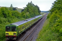 This is a view from the road overbridge at the northern extremity of Donabate. 8500 Class DART units Nos.8604+8603 are seen been hauled by a northbound 29000 diesel railcar. The DARTs were heading from Fairview Depot for servicing at Drogheda.