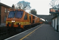 In late 2001, 201 Class locomotive No.223 passes through Donabate Station on an afternoon pushpull train to Drogheda. This type of service has long since been in the hands of 29000 Class diesel railcars.