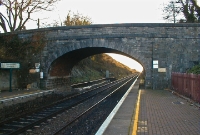 This is the original 1840s stone built road overbridge at Donabate Station, as it was in late 2001. The platforms once extended beyond the bridge, the down side of which was still in stiu. The bridge was soon demolished to accommodate the widening of the busy road leading into Donabate village.