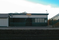 This is an earlier view of the GNR wooden waiting shelter on the down platform at Donabate Station when it was still open to the public in late 2001.
