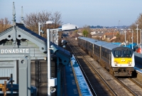 Construction work for the adjacent new footbridge at Donabate is visible in this view as French built De Dietrich driving van trailer No.9003 leads a southbound &#39;Enterprise&#39; from Belfast through the station.