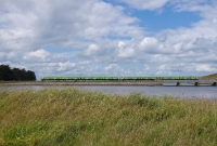 An 8-car 29000 Class railcar set heads for Dublin, seen crossing the Rogerstown Estuary near Donabate.