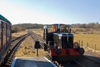 G617 is seen at Inch Abbey Halt having run round a service which it had brought from Downpatrick. The track layout at Inch Abbey includes a run round loop, single platform and a bay which is currently occupied by a carriage seen on the left.