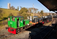 The three G Class locos are seen lined up outside the locomotive shed at Downpatrick. Green liveried G611 originally worked as a shunter at the Thurles beet factory in north Co.Tipperary, as with G617. While G613 in the black &#38; tan livery originally operated at the other beet factory at Tuam in Co.Galway.