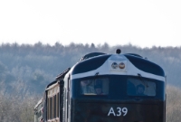 Ex CIE A Class locomotive No.A39 was built by Metropolitan Vickers at Manchester in 1955. It was re-engined in 1969 with a General Motors power unit and was finally withdrawn by Irish Rail in Autumn 1995. A39 is seen here approaching Downpatrick from the south.