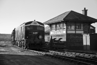 The evening sun catches Downpatrick signal cabin as A Class A39 arrives on an ITG special during the &#39;A39 Launch&#39;. Signalling equipment such as semaphore signalis currently being installed around the station to connect up with the cabin.