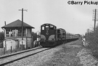 Passing Downs Bog with a Sligo to Dublin train in the late 1980s are a pair of 121 Class locomotives, with No.131 leading. The signal cabin once had a 14-lever frame. ©Barry Pickup
