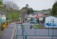 A distant view of the former Drimoleage Station, from what was the overbridge. Straight ahead was the line to Baltimore, the trackbed of which is now obstructed by a small bungalow. The Victorian footbridge which spanned the tracks was once sited on the left.