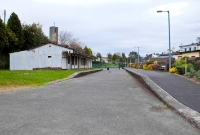 The former station at Drimoleague, once a busy railway location. This view is looking towards Cork from the west end of the station, showing the up &#38; down platforms and single storey station building.