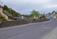 This was Drimoleague level crossing, located on the R586 road at the west end of the station on the Baltimore line. This view is looking across the road towards the station.