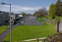 Drimoleage Station, viewed from what was the overbridge at the east end of the station, looking west towards Bantry. To the right was the former loco shed. The up platform, as well as the platform to the rear of the station building once extended to the where the tennis court is now.
