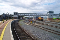 A general view from the south end of Drogheda Station, showing the new footbridge used by staff to access the diesel railcar depot just visible on the extreme right. A 201 Class locomotive is seen stabled adjacent to the depot.