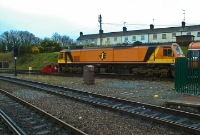 Seen stabled on the Navan branch at the south end of Drogheda Station is 201 Class loco No.220, with a rake of Mk3 pushpull stock. The houses visible in the background were built by the Great Northern Railway and are located on the appropriately named road &#39;Railway Terrace&#39;.