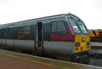 One of the French built De Dietrich &#39;Enterprise&#39; driving van trailers No.9004, is seen at the head of a southbound &#39;Enterprise&#39; service at Drogheda Station. The dull grey livery has since been replaced by much brighter green and white colours.