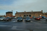 The single storey brick built station building at Drogheda, dating from 1853 and built by the Dublin Drogheda &#38; Belfast Junction Railway. To the left can be seen the large water tower, complete with tank.