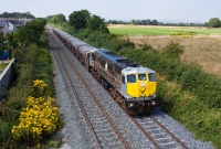 071 Class loco No.080, sporting its borrowed orange &#38; black liveried cab doors, approaches Colp Bridge with the midday loaded Tara Mines to Alexandra Road ore train.