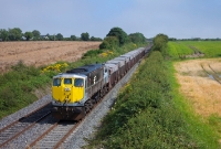 Approaching Drogheda from the south at Colp Bridge is 071 Class loco No.082, seen again hauling the empty rake of Tara Mines wagons from Alexandra Road to Navan.