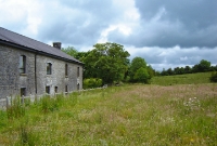 This view is taken at the east end of Dromahair Station looking towards Enniskillen. The building on the left is a grain store and was unconnected to the railway.